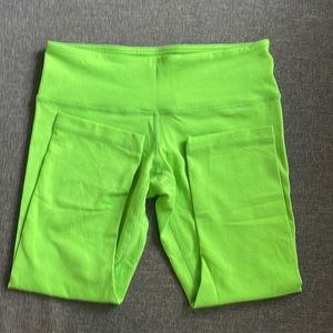 Lululemon bright green leggings.  Hidden pocket at front waist.